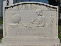 erected in 1941, the Emma Willard Memorial is located in a triangular-shaped park in Middlebury, Vermont