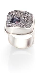 organic crystalline rock with garnet gemstone and sterling silver band
