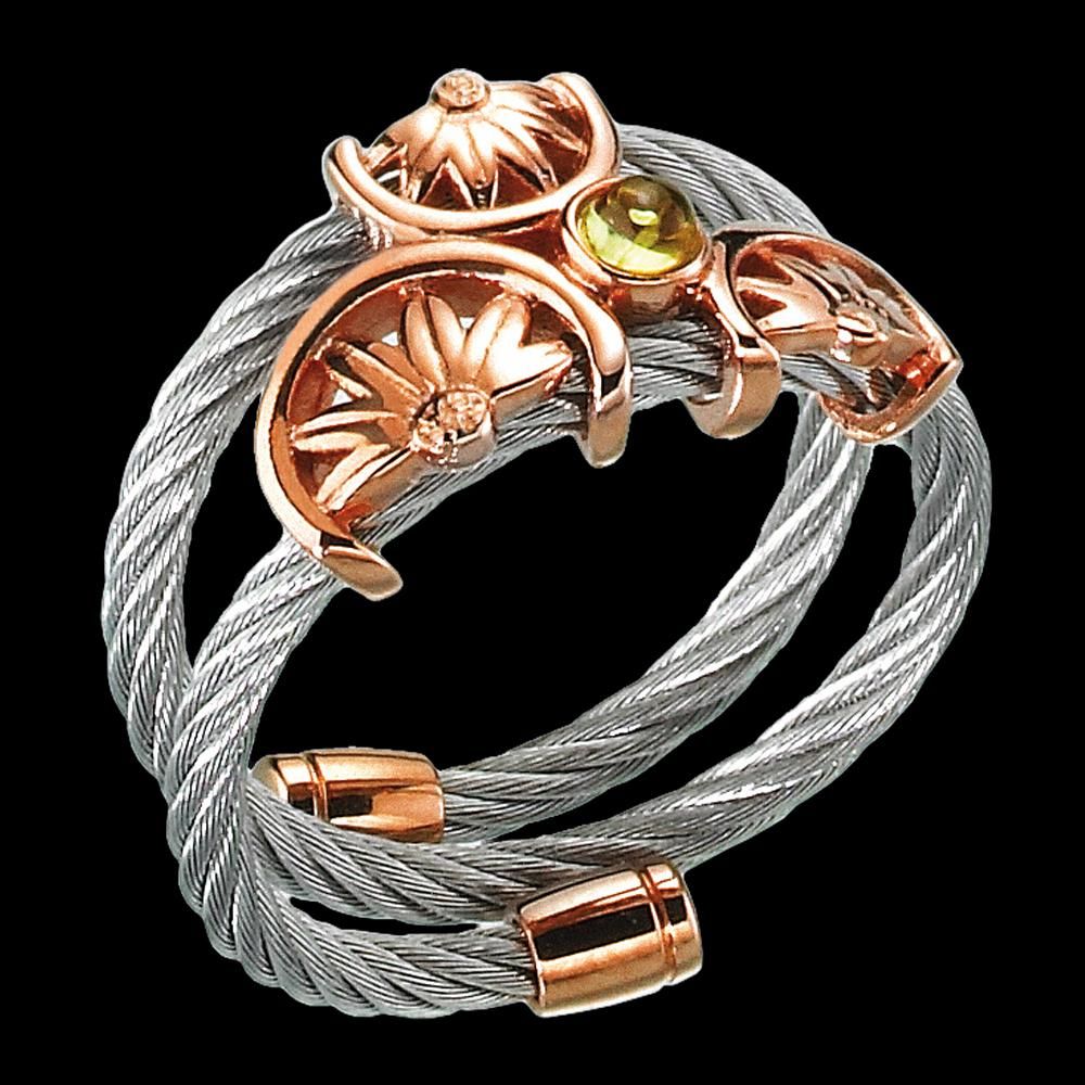silver cable design ring with pink gold plated accents and peridot stone