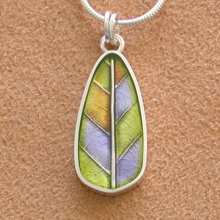 an elm leaf pendant in Precious Metal Clay colored with resin enamel