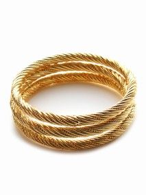 set of gold bracelets