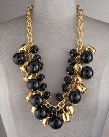 designer necklace made of gold and black beads on a chain