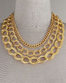 designer necklace made of 18K gold three strand chain