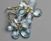 blue topaz stones wire wrapped into flower shapes