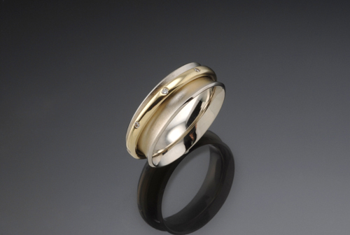 two-tone gold and diamond orbit ring
