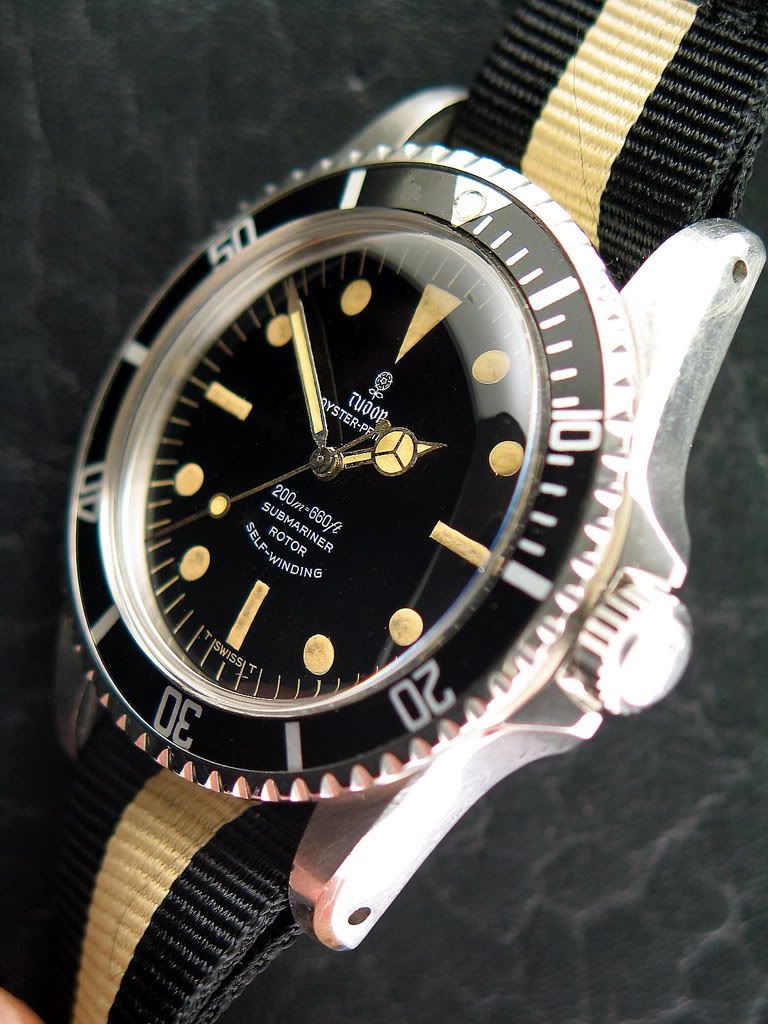 http://i157.photobucket.com/albums/t64/stahlauctioneers/tudor7928military-3.jpg