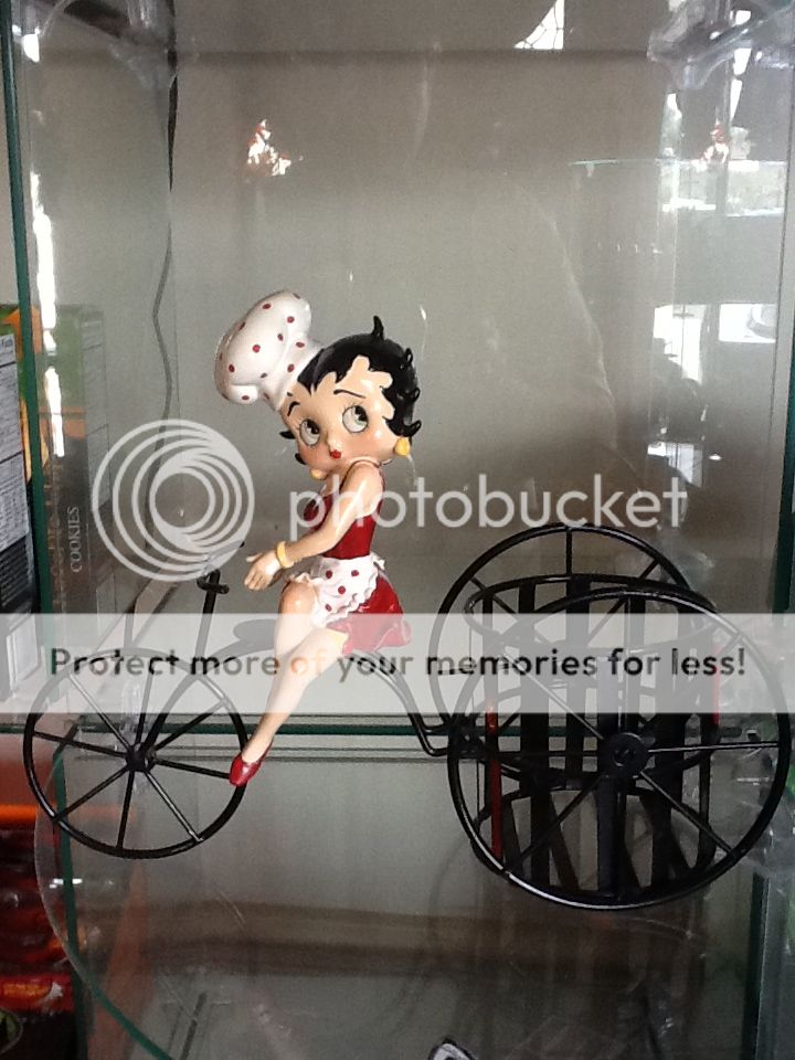 Retro Betty Boop in Chef's Hat and Apron Riding A Tricycle Bottle Caddy Planter